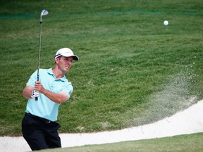 Mike Weir of Canada plays a shot from the bunker on the fourteenth hole during the third round of the HP Byron Nelson Championship at the TPC Four Seasons on May 17, 2014 in Irving, Texas. (Sam Greenwood/Getty Images/AFP)