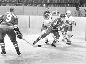 Houston Aeros' Gordie Howe (left) in a World Hockey Association game against the Toronto Toros in the 1970s in Toronto. (Toronto Sun files)