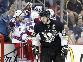 Pittsburgh Penguins centre Sidney Crosby (87) reacts as the New York Rangers celebrate a goal by Rangers centre Brian Boyle (not pictured) during the first period in Game 7 of the second round of the 2014 Stanley Cup Playoffs at the CONSOL Energy Center.(Charles LeClaire-USA TODAY Sports)