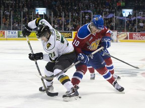 London Knights forward Chris Tierney and Edmonton Oil Kings forward Henrik Samuelsson search for the puck at their feet during their 2014 Memorial Cup round robin hockey game at Budweiser Gardens in London, Ontario on Sunday May 18, 2014.
CRAIG GLOVER The London Free Press / QMI AGENCY