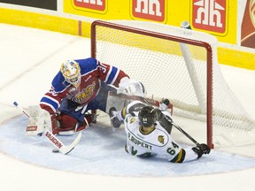London Knights forward Ryan Rupert slides into Edmonton Oil Kings goaltender Tristan Jarry after being tripped on a breakaway during their 2014 Memorial Cup round robin hockey game at Budweiser Gardens in London, Ontario on Sunday May 18, 2014.
CRAIG GLOVER The London Free Press / QMI AGENCY