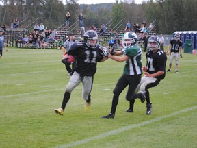 Whitecourt Cats player Ty Babiuk stiff arms an Athabasca Pacers defensive player during a controlled scrimage at Graham Acres Sports Field on Thursday, Aug. 29. The Cats season officially starts on Sept. 6 with a home game against a team from Peace River.
Barry Kerton | Whitecourt Star