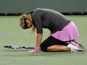 Victoria Azarenka (BLR) grimaces as she lands on her left ankle during her match against Lauren Davis (not pictured) at the BNP Paribas Open at the Indian Wells Tennis Garden on Mar 7, 2014 in Indian Wells, CA, USA. (Jayne Kamin-Oncea/USA TODAY Sports)