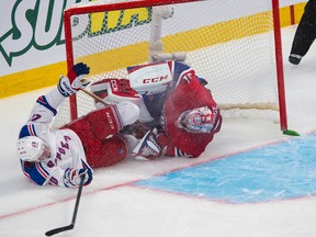 Rangers forward Chris Kreider crashes into Canadiens goaltender Carey Price during second period action in Game 1 of their Eastern Conference final in Montreal on Saturday, May 17, 2014. (Ben Pelosse/QMI Agency)