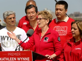 Liberal Leader Kathleen Wynne is surrounded by Liberal candidates during a campaign stop Monday at Ontario Place. (DAVE THOMAS, Toronto Sun)