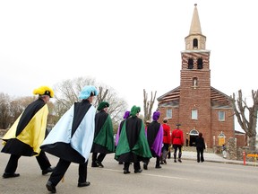 Members of the Knights of Columbus march to the St. Paul Cathedral for the funeral Mass of Reverend Gatsou Gilbert Dasna, in St. Paul Alta., on Monday May 19, 2014. Rev. Gilbert Dasna was shot in the chest at the door of the rectory where he lived in St. Paul, May 9, 2014. David Bloom/Edmonton Sun/QMI Agency