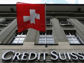 The logo of Swiss bank Credit Suisse is seen below the Swiss flag at a building in the Federal Square.

REUTERS/Ruben Sprich