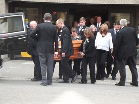 Jim Moodie/The Sudbury Star                      
Pallbearers carry the casket of Nicole Belair following her funeral at St. Andrew's United Church on Monday. The CAS worker was fatally injured in an apartment fire in Hanmer last week.