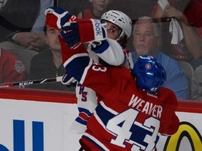 Canadiens' Mike Weaver hits a New York Ranger during last night's game in Montreal. (MARTIN CHEVALIER/QMI AGENCY)