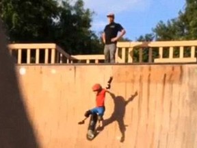 Marcus Crossland watches as his son Dino falls down a skateboard ramp.

(Instagram)