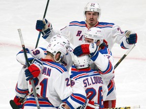 New York Rangers right wing Martin St. Louis (26) celebrates his goal against Montreal Canadiens with teammates during the second period in game two of the Eastern Conference Finals of the 2014 Stanley Cup Playoffs at Bell Centre. (Jean-Yves Ahern-USA TODAY Sports)