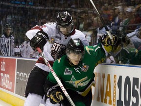 Val d'Or Foreurs player Nicolas Aube-Kubel is checked into the boards by Guelph Storm player Zach Leslie during their 2014 Memorial Cup round robin hockey game at Budweiser Gardens in London, Ont. on Monday. (Craig Glover, QMI Agency)