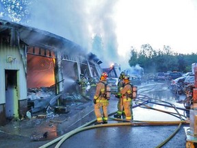 Firefighters battle a two-alarm blaze at Auto World on the Ramsayville Rd. in south Ottawa Tuesday morning, May 20, 2014. No one was injured, but the shop was destroyed. (OTTAWA FIRE DEP'T photo)
