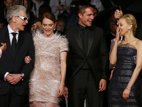 Director David Cronenberg, cast members Julianne Moore, Robert Pattinson and Sarah Gadon pose on the red carpet as they arrive for the screening of the film "Maps to the Stars" in competition at the 67th Cannes Film Festival in Cannes May 19, 2014.  (REUTERS/Regis Duvignau)