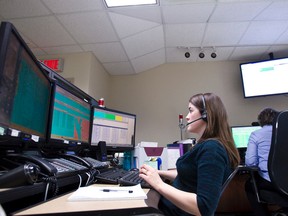 Telecommunications operators answering calls at the RCMP 'K' Division Operational Communications Centre in Edmonton, Alta., on Friday, December 21, 2012. Two centres in Alberta, one in Edmonton and one in Red Deer, are projected to handle 240,000 911 calls this year. Ian Kucerak/Edmonton Sun