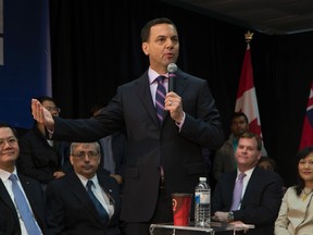 Ontario PC Leader Tim Hudak at the Chinese Cultural Centre in Scarborough for a town hall meeting on Tuesday, May 20, 2014. Also on hand is federal Foreign Affairs Minister John Baird (second from right), a former colleague in the Mike Harris government. (Jack Boland/Toronto Sun)