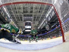 The puck flies past Val d'Or Foreurs goaltender Antoine Bibeau during their 2014 Memorial Cup round robin hockey game against the Guelph Storm at Budweiser Gardens in London, Ontario on Monday May 19, 2014. CRAIG GLOVER The London Free Press / QMI AGENCY