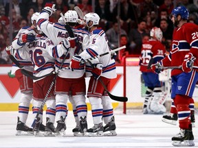 The Rangers' Ryan McDonagh celebrates with his teammates after scoring against Montreal in Game 2 on Monday. McDonagh's goal came off a scrambly play that cannot be easily measured with advanced stats. (Getty Images/AFP)