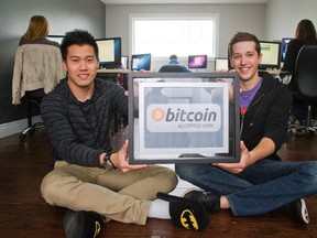 Larry Lau and Corey Dubeau, founders of ATMOS, are accepting Bitcoin as payment in London. (MIKE HENSEN, The London Free Press)