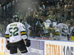 London Knights fans celebrate after defenceman Alex Basso scores a goal during their 2014 Memorial Cup round robin hockey game against the Edmonton Oil Kings at Budweiser Gardens in London, Ontario on Sunday May 18, 2014. (CRAIG GLOVER, The London Free Press)