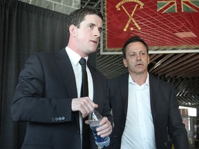 New coach Paul McFarland was introduced by Frontenacs' General Manager Doug Gilmour at a news conference Tuesday.