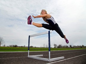 Lexi Aitken, 16, a grade 11 student at St. Anne's Catholic Secondary School in Clinton is ready to take on all comers as a top Canadian hurdler, coming to compete this week in London, Ont. for WOSSAA on on Thursday and Friday May 22-23, 2014. (Mike Hensen, The London Free Press)