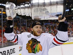 Chicago Blackhawks' Patrick Kane celebrates with the Stanley Cup after the Blackhawks defeated the Boston Bruins in 2013(REUTERS/Brian Snyder/Files)