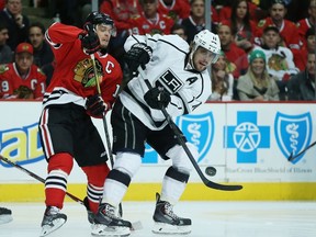 Kings’ Anze Kopitar controls the puck against Jonathan Toews during Game 1. The two stars will be back at each other tonight. (AFP)