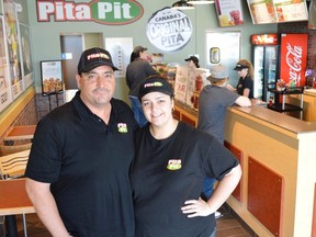 Jim Moodie/The Sudbury Star
Mike and Julie Marsh show off their new Pita PIt franchise in Val Caron. The couple says business has been booming since they opened in April.