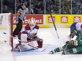 Pierre Maxime Poudrier of the Val-d?Or Foreurs hits the ice as his shot squeaks through Edmonton Oil King goalie Tristan Jarry for a goal during the second period of their Memorial Cup game at Budeweiser Gardens on Tuesday night. (DEREK RUTTAN, The London Free Press)