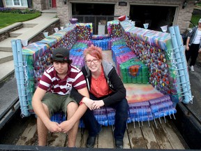 Jennifer Vermeulen Anderson and her son Adam Anderson, 16, with their plastic bottle boat. IAN MACALPINE/THE WHIG-STANDARD