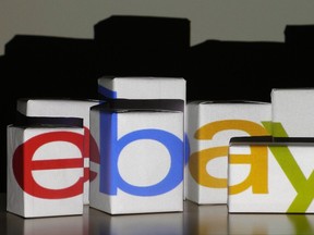 An EBay logo is projected onto white boxes in this illustration picture taken in Warsaw, Jan. 21, 2014.  REUTERS/Kacper Pempel