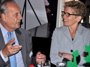 Dr. August Oetker (left) and Ontario Premier Kathleen Wynne have a conversation at the grand opening of the Dr. Oetker facility in south London May 20, 2014. CHRIS MONTANINI\LONDONER\QMI AGENCY