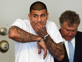 New England Patriots tight end Aaron Hernandez is arraigned on charges of murder and weapons violations in Attleborough, Massachusetts, after being arrested, in this June 26, 2013 file photo. (REUTERS)