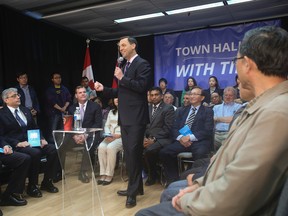 Ontario PC leader Tim Hudak was at the Chinese Cultural Centre in Scarborough for a town hall meeting on May 20, 2014 and was joined by federal Foreign Affairs Minister John Baird, a former colleague in the Mike Harris government. (Jack Boland/QMI Agency)
