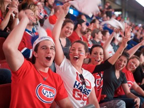 Fans watch Game 7 on the big screen at the Bell Centre as the Canadiens faced the Bruins in Boston on May 14, 2014. Bar owners are threatening to sue the club for opening up the rink to fans and selling beer, accusing the team of taking away their business. (Jacques Pharand/QMI Agency)