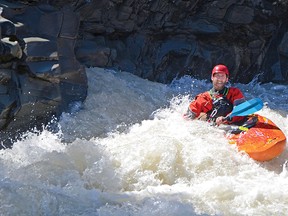 A kayaker smiles after taking on the falls on Castle River over the long weekend. John Stoesser photo/QMI Agency