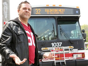 Victor Bulario stands at the spot where his TTC bus driver left the bus and never returned, leaving 20 passengers stranded for almost 30 minutes the day before, Wednesday, May 21, 2014. (Dave Thomas/Toronto Sun)