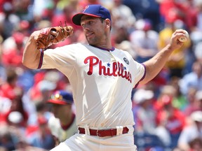 Philadelphia Phillies starter Cliff Lee pitches in the first inning against the Cincinnati Reds at Citizens Bank Park. ( Bill Streicher/USA TODAY Sports)