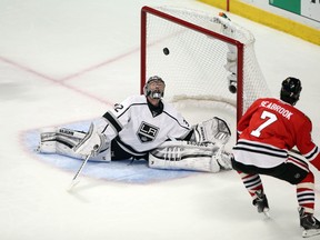 Kings goalie Jonathan Quick looks up at the puck after making a save against Chicago Blackhawks last night. (USATODAY/photo)