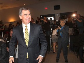 Jim Prentice arrives at the Metropolitan Centre in Calgary, Alta. on Wednesday May 21, 2014 with his wife Karen where he greeted supporters and officially announced his candidacy for PC party leadership.  
Darren Makowichuk/Calgary Sun/QMI Agency