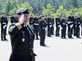 Lt.-Col. Dan Bobbitt salutes before taking command of the 2nd Regiment, Royal Canadian Horse Artillery, last June at Garrison Petawawa. Lt.-Col. Bobbitt was killed in a vehicle accident Wednesday in Wainwright, Alta.  (SEAN CHASE/QMI Agency)