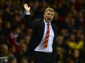 Then Manchester United's manager David Moyes gestures during their English Premier League soccer match against Sunderland at The Stadium of Light in Sunderland, northern England, in this October 5, 2013 file photo.  (REUTERS/Nigel Roddis/Files)
