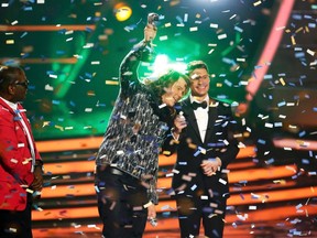 Winner Caleb Johnson speaks on stage with Randy Jackson (L) and Ryan Seacrest during the American Idol XIII 2014 Finale in Los Angeles, California May 21, 2014.  REUTERS/Mario Anzouni