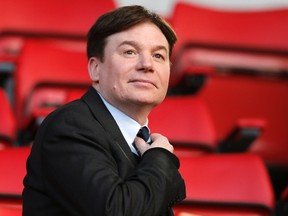 Actor Mike Myers sits in the stands before Liverpool faces Fulham in their English Premier League soccer match at Anfield in Liverpool, northern England November 9, 2013. (REUTERS/Phil Noble)