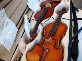 Stolen 16 years ago, two valuable violins, one of which appears to be signed by the master craftsman Stradivarius, were found in Montreal last week. (ERIC THIBAULT/QMI Agency)