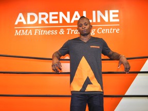 London-based mixed martial artist Malcolm Gordon leans on the ropes inside a boxing ring at Adrenaline MMA Training and Fitness Centre in London, Ont. May 20, 2014. After winning a short notice bout at Bellator 119, opportunities continue to open up for Gordon, a top-ranked Canadian flyweight. CHRIS MONTANINI\LONDONER\QMI AGENCY