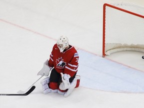 Goaltender Ben Scrivens allows the eventual game-winner from Finland's Iiro Pakarinen during third period quarterfinal action at the world championships in Minsk, Belarus, on Thursday, May 22, 2014. (Vasily Fedosenko/Reuters)