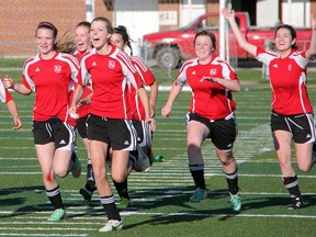 The Northern Vikings senior girls soccer team reacts to the game winning save by keeper Lena Nichols during Thursday, May 22's LSSAA soccer championships. Nichols made two saves in penalty kicks, leading the vikings to a 2-1 victory over the St. Patrick's Fighting Irish. (SHAUN BISSON, The Observer)
