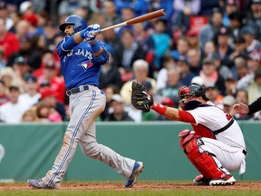 Blue Jays right fielder Jose Bautista takes a mighty cut against the Red Sox on Thursday. (Greg M. Cooper/USA TODAY Sports)